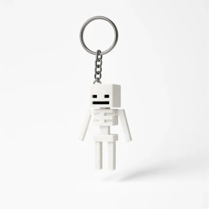 Biały brelok szkielet inspirowany Minecraft na białym tle