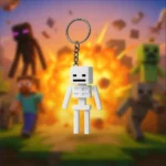 Brelok szkielet inspirowany Minecraft na tle blokowego wybuchu